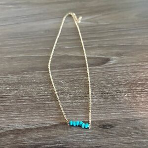 Elegant Gold Necklace with Turquoise Accents
